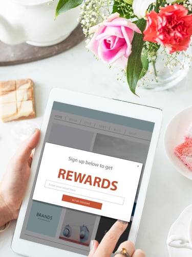 Customer signing up for rewards program on a tablet computer
