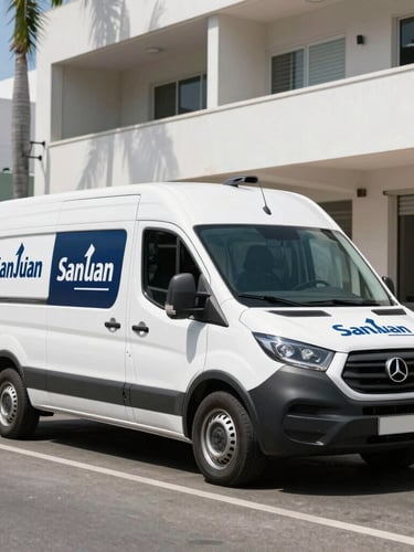 A commercial service van with branded markings parked on a bright San Juan street in high daylight, sharp focus, 35mm lens.