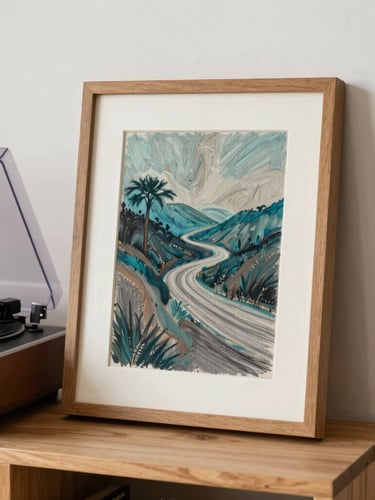 A framed oil pastel drawing with deep teal and warm gray tones, styled on a wooden shelf next to a record player in a bright California studio, soft shadows.