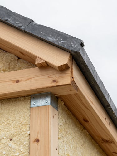 Crisp architectural detail of a craftsman installing wood cladding boards over high-density insulation panels, precise metal joints, overcast daylight.