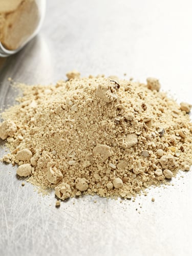 Close-up macro shot of dehydrated ginger powder on a clean stainless steel surface, bright industrial light, crisp details emphasizing texture and purity, professional commercial lens.
