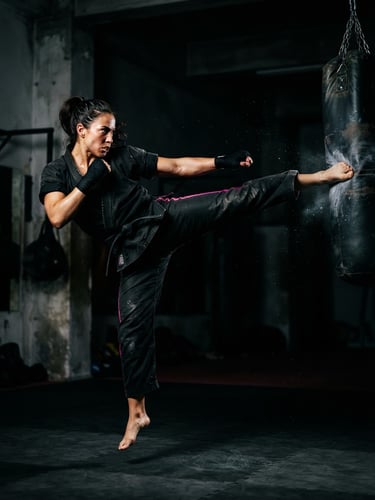 Dynamic athletic action shot of a martial artist mid-kick, high-contrast dramatic key lighting, deep shadows, electric fuchsia accents, 35mm