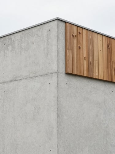 Straight-on architectural photography of a concrete wall junction with a clean joint detail, soft natural overcast daylight, sharp focus, minimalist composition, 35mm lens