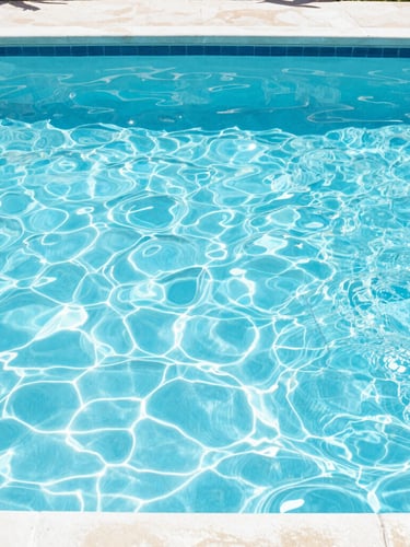 A wide-angle pristine backyard poolscape in Orlando, bright high-key midday Florida sunlight, sparkling clear blue water, sharp focus, 35mm