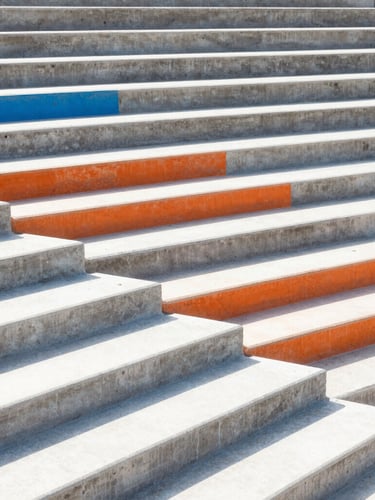 Abstract geometric pattern of concrete steps under harsh sunlight, strong diagonal shadows, bright daylight, architectural scale.