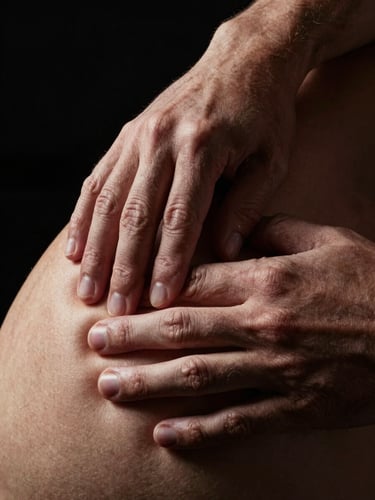 Close-up of hands-on manual physical therapy, fingers mobilizing deep tissue on a shoulder, dark dramatic lighting, high contrast