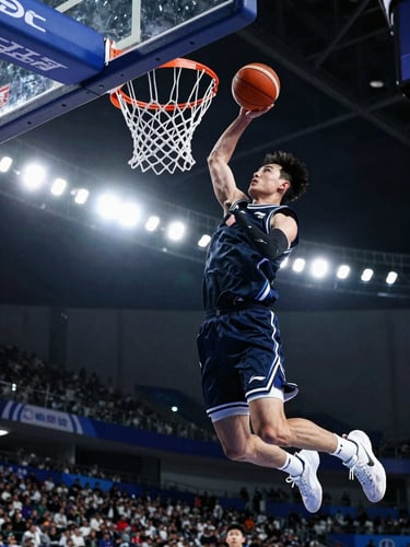 Low-angle heroic shot of a young basketball player mid-dunk, dramatic stadium floodlights, high-contrast cool tones, sharp action freeze.