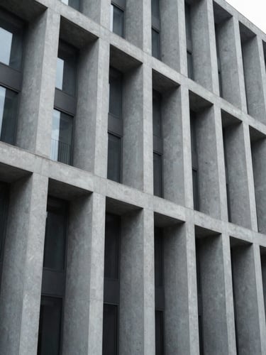 Wide-angle architectural crop of a modern civic building facade, sharp geometric lines, cool-toned daylight, desaturated corporate tones