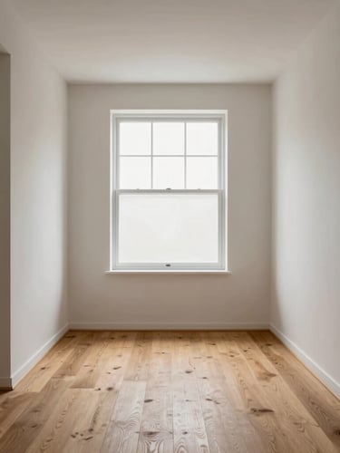 Architectural interior photography of a newly finished minimalist living room, straight-on view, crisp drywall lines, soft natural window light highlighting smooth plaster textures, warm oak flooring planks, 35mm