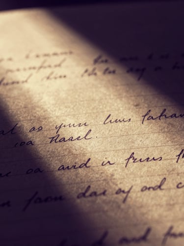 Macro shot of a vintage screenplay script page with handwritten notes, dramatic shadows, warm gold highlights, high-contrast low-key lighting, 35mm.