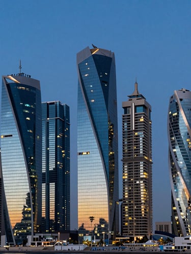 Dramatic twilight wide shot of Dubai Marina skyline, geometric glass towers reflecting deep blue sky and golden lights, clean modern architectural lines, high contrast.