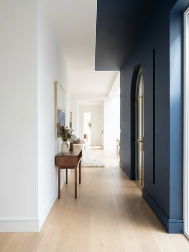 Bright architectural interior with sharp paint lines, natural daylight illuminating clean white and navy walls, high-end residential aesthetic, 35mm lens