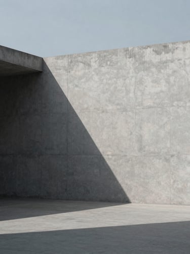 Minimalist architectural photography of concrete structural planes and sharp geometric shadows under cool overcast daylight, high-contrast composition, desaturated cool tones, 35mm.