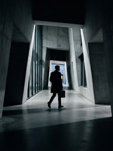 Cinematic low-key photography, sharp silhouette of an elite legal professional walking through a monolithic concrete corridor at dusk, deep shadows, cold silver tones, 35mm