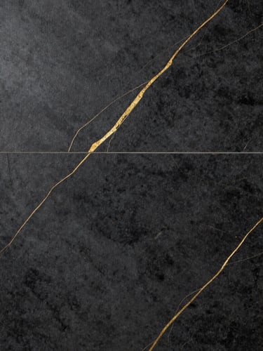 Straight-on flat lay of premium dark ceramic tile with gold veins, dramatic gallery lighting, high-contrast texture