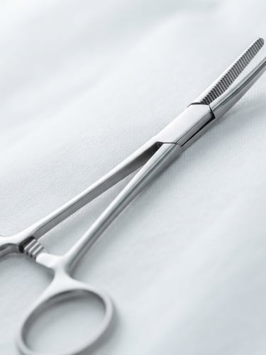 Macro close-up of surgical forceps made of high-grade stainless steel, resting on a sterile white surface, bright clinical light, sharp focus, soft silver reflections