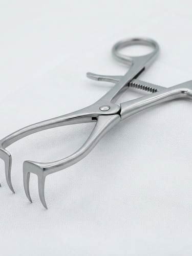 Macro photograph of a surgical steel retractor on a sterile white surface, bright clinical light, sharp focus, silver reflections