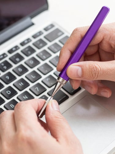 Bright clean photography, soft natural daylight, close-up of hands carefully repairing a laptop keyboard with precision tools, subtle purple accent