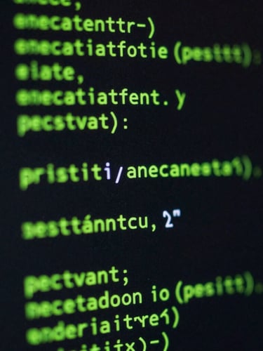 Macro shot of syntax-highlighted code on a dark terminal screen, low-key neon green glow, 35mm photography