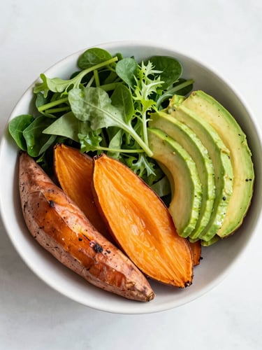 Bright editorial food photography, soft natural daylight, overhead flat-lay of a colorful, nutrient-dense harvest bowl with roasted sweet potatoes, avocado, and fresh greens.