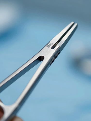 Macro close-up of sterile surgical steel instrument, cool blue clinical lighting, sharp focus on metallic edges, clean background.