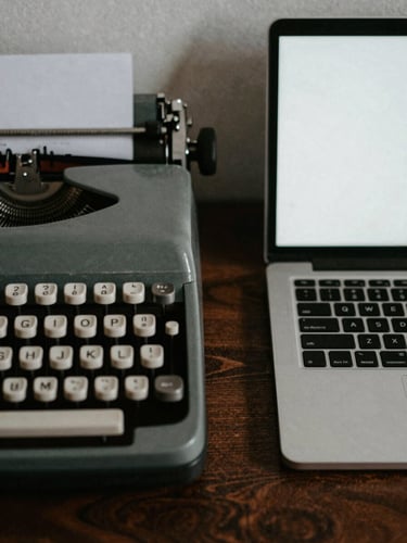 Raw photojournalism, high-contrast dramatic shadow, a close-up of a vintage typewriter and a modern encrypted laptop side-by-side on a dark wooden desk, moody lighting, 35mm film grain