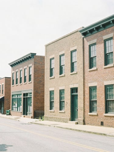 A bright, natural overcast daylight photo of a clean Westboro streetscape with distinctive brick architecture, soft shadows, taken with a 35mm lens