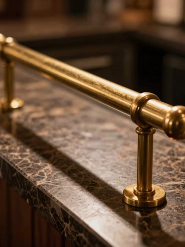 Extreme close-up of a premium brass bar rail and dark marble counter, warm low-key hospitality lighting casting long shadows.