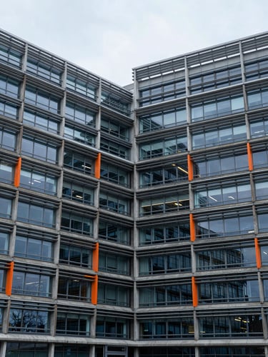 Architectural detail of the European Commission building in Brussels, cool overcast daylight, structured concrete and glass facade, 35mm lens
