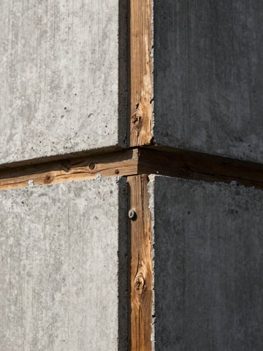 Tactile architectural detail of raw concrete meeting weathered timber joints, high-contrast side lighting, structural integrity focus.