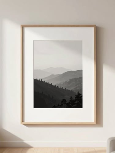 Straight-on eye-level shot of a bright, modern, minimalist living room with a large custom-framed print hanging on a warm off-white wall, soft natural daylight casting gentle shadows, 35mm lens, shallow depth of field
