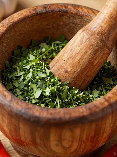 Close-up macro shot of fresh green epis being ground in a traditional wooden mortar and pestle, vibrant green herbs, garlic cloves, and bright red scotch bonnet peppers, warm natural light.