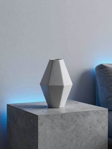 Minimalist modern living room with a custom geometric vase on a concrete side table, cool crisp studio lighting with subtle blue neon edge-lights, sharp focus, 35mm