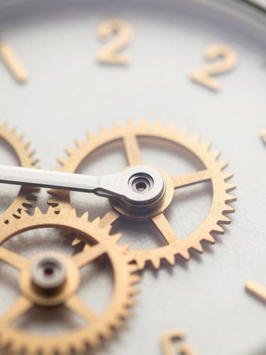 Macro detail shot of fine watch gears under bright, natural daylight, warm ochre highlights, clean architectural composition, 35mm lens