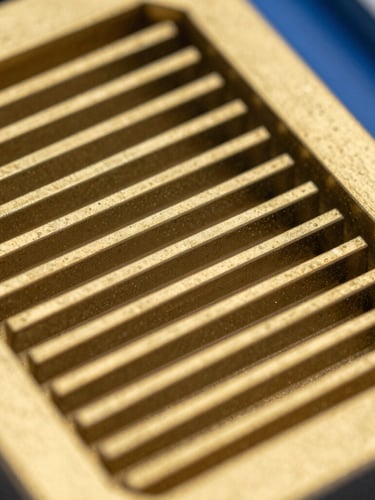Macro detail shot of a golden yellow composite grating structure, extreme close-up, sharp focus, high-contrast industrial lighting, 35mm