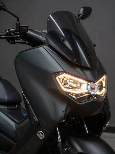 Sleek close-up of a Yamaha Nmax motorcycle headlight glowing in a dark room, golden reflections on the matte black body