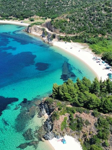 Crystal-clear turquoise waters and hidden bays in Halkidiki, Greece