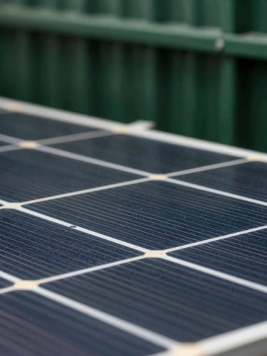 Macro shot of a high-efficiency photovoltaic cell grid, sharp technical details, crisp lighting, deep forest green structural elements in the background.