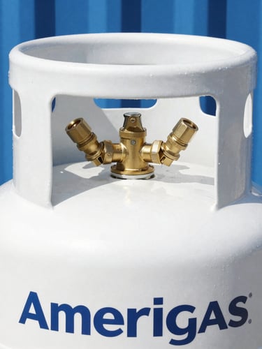 Crisp commercial photography of a clean white Amerigas propane tank with brass valves, bright natural daylight, sharp focus, 35mm