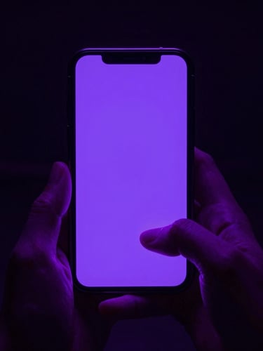 First-person perspective of hands holding a smartphone in a dark room, neon violet screen glow casting light on fingers, high contrast cyberpunk photography.
