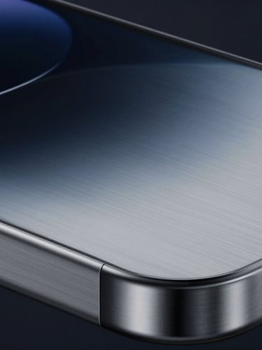 Macro close-up of a brushed titanium Apple-style hardware casing, subtle metallic reflections, cool diffused studio light, high-tech engineering concept