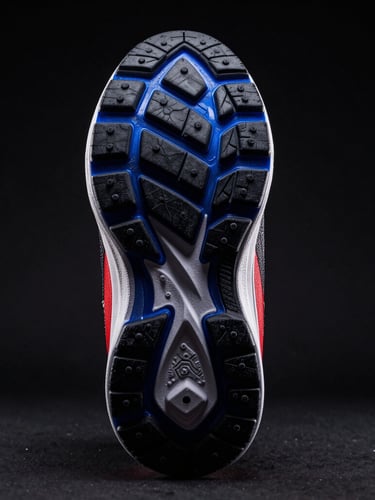 Low-angle dramatic studio shot of athletic shoe tread, high-contrast rim lighting, deep black background with royal blue gel highlights, sharp 85mm focus.