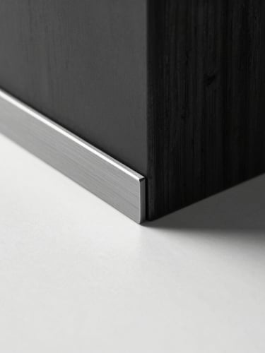 Minimalist studio photography, stark monochrome, high-contrast cool studio light, close-up of premium matte steel and dark wood textures, sharp shadows, architectural composition
