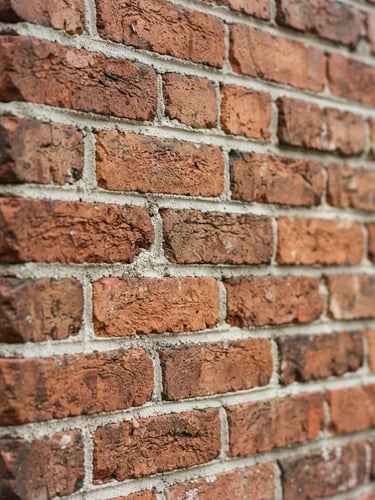 Close-up of freshly tuckpointed brick chimney facade on a historic Utah home, natural daylight, sharp focus on mortar texture, warm terracotta tones, 35mm
