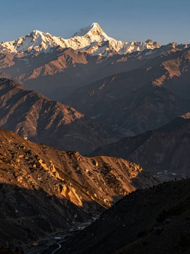 Dramatic wide-angle landscape of the Phulchoki mountain range at golden hour, looking out over the Kathmandu Valley with the distant snow-capped Himalayas visible under a crisp alpine sky, majestic composition.