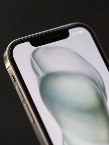 Extreme macro close-up of a high-end luxury smartphone displaying a custom fluid interface, soft side-lighting reflecting off brushed steel and curved glass edges, dark background