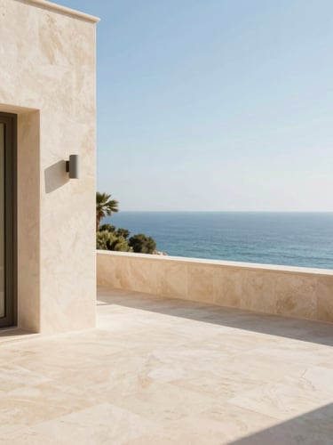 Bright editorial photography of a luxury villa terrace overlooking the Mediterranean sea at Les Issambres, warm morning light, soft beige stone, clear blue water, 35mm