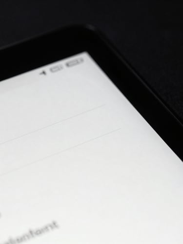 Extreme close-up macro shot of a physical Android screen running a minimalist black and white e-ink interface. High contrast, sharp shadows, low-key studio lighting.