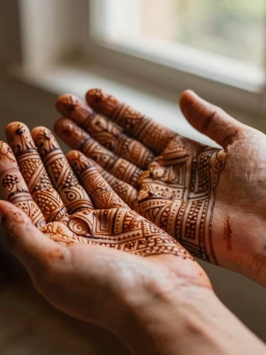 Macro photograph of freshly applied botanical mehndi on hands, intricate geometric lines, warm natural window light, rich terracotta tones, shallow depth of field, 35mm