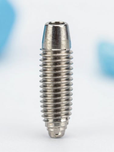 Macro close-up of a high-tech titanium dental implant fixture, clean white background, bright clinical daylight, soft blue accents, sharp focus.